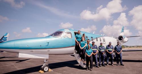 Some of Bohlke International Airways team next to jet